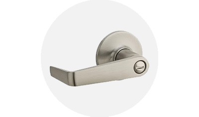 Kwikset Commercial Door Hardware product isolated on top of a gray circle